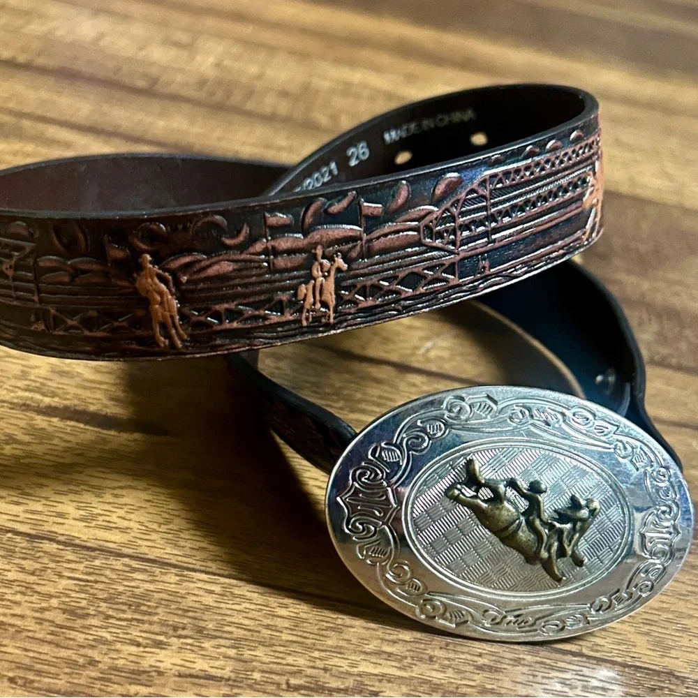 Nocona ~Boy's Size 26 ~Bull Rider Belt Buckle W/ Brown Rodeo Scene Leather Belt - Picture 1 of 9